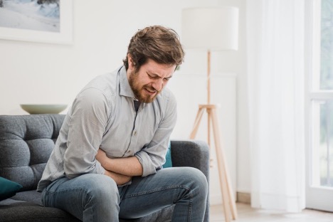 young-guy-suffering-from-stomach-ulcers